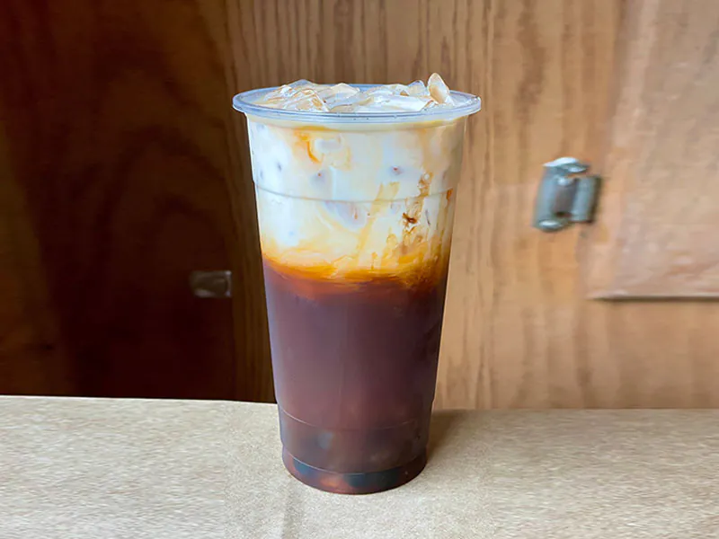 Sweet creamy Thai iced tea with caramel layers at Funtime Sushi & Ramen & Tea Bar, a Asian Restaurant in Nashville